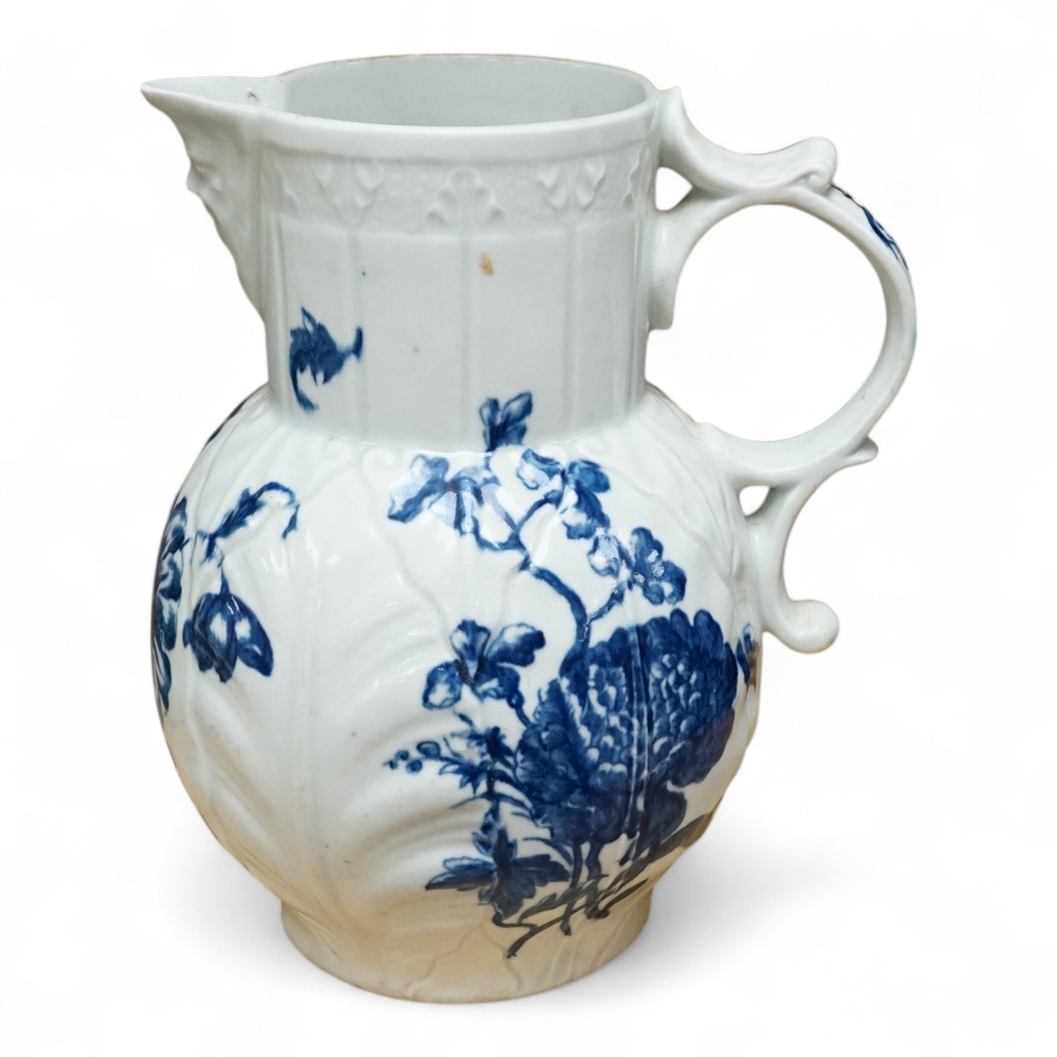 A Caughley blue and white transfer printed mask jug, c. 1780, 21cm high